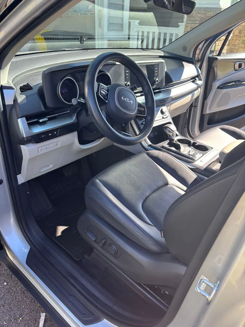 Kia driver's seat, steering wheel and dashboard cleaned with mats in place