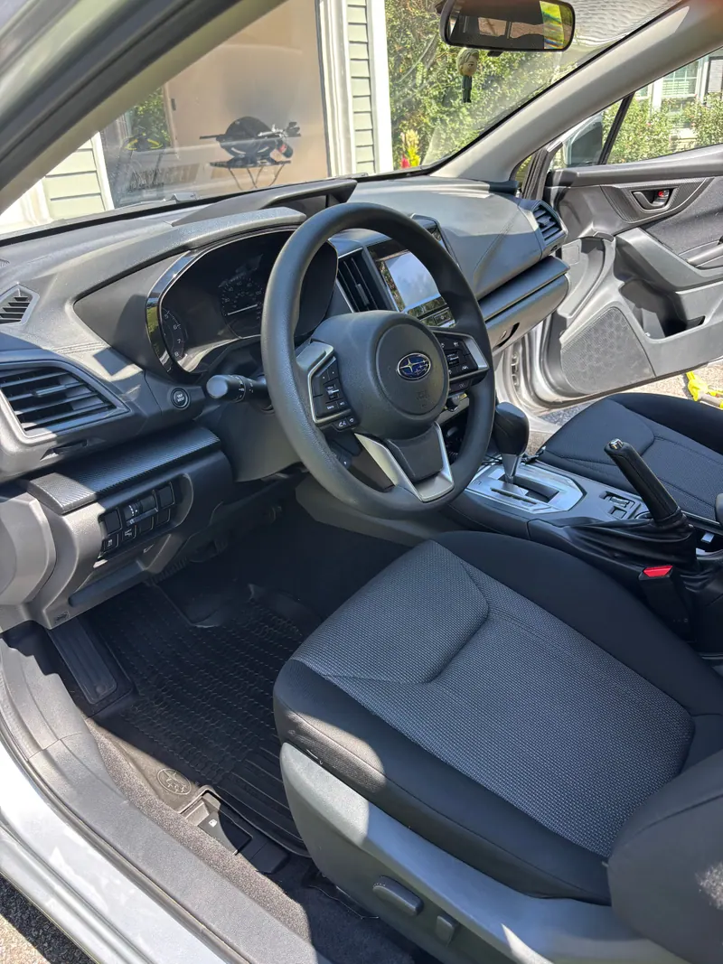 Subaru Impreza driver's seat, steering wheel and dashboard cleaned