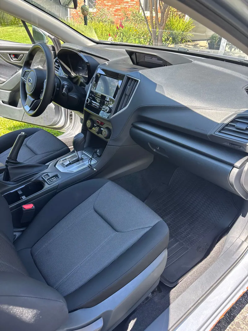 Passenger side of the Subaru Impreza dashboard with all-weather mats cleaned