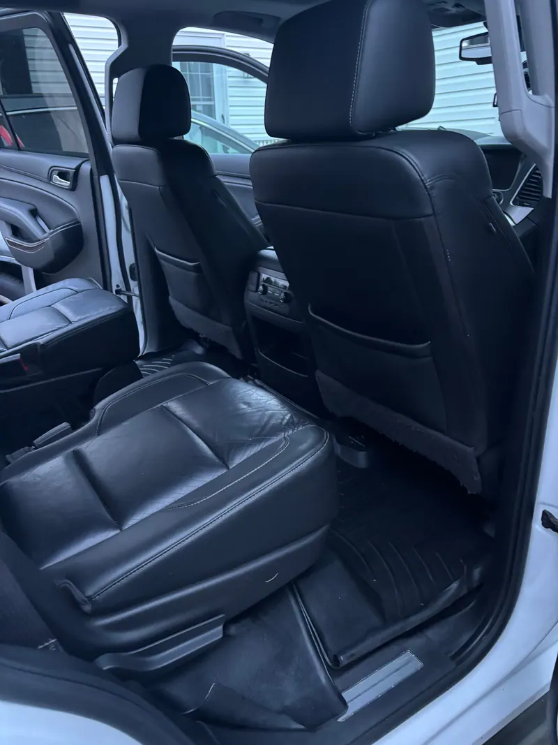 Rear seats of the Chevrolet Tahoe in black leather, seats and liners cleaned