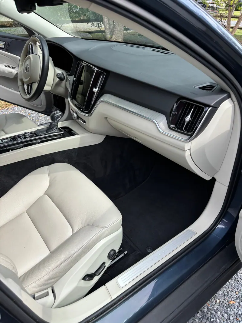 Passenger side of the Volvo V60 dashboard and footwell, trim and vents detailed